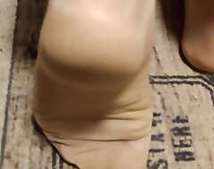 different footplay in tan nylons