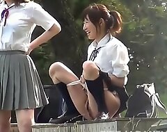 Immature Asian school girls play with piss