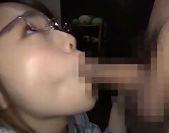 Cute Asian girl with glasses gives a great head on cam